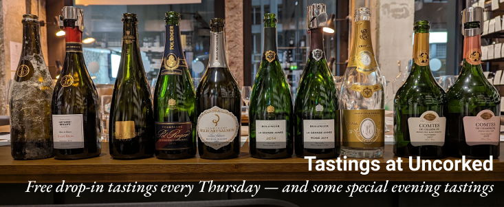 Previous evening Champagne tasting lineup Champagne bottles in the Uncorked shop with caption: Tastings at Uncorked, free drop-in tastings every Thursday - and some special evening tastings
